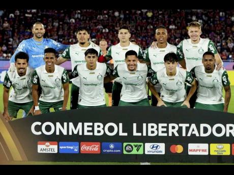
Players of Brazil’s Palmeiras pose for a team photo before a Cope Libertadores Group G soccer match against Paraguay’s Cerro Porteno at La Nueva Olla stadium in Asuncion, in Paraguay, on Wednesday, May 7.