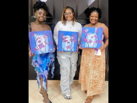 From left: Young Warriors Kiana Jackson, Jhada Marie Graham and Alexis Thompson displaying their portraits of strength along with smiles of hope.