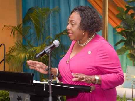 Minister of Culture, Gender, Entertainment and Sport, Olivia Grange, delivers the keynote address during the Ministry’s Outstanding Father Awards Ceremony on June 13 at The Jamaica Pegasus hotel in New Kingston. 