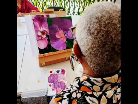 Credit: Contributed Janice Campbell, a past participant, immersing herself in her art.