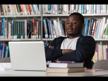 Representational image of a student sitting in a library.