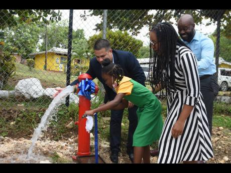 Credit: File
From left: Matthew Samuda, minister with responsibility for water, takes part in a symbolic turning on of a hydrant during the official commissioning of the Baron Hill to Samuel Prospect pipeline replacement project in Trelawny in 2022. Also pictured are