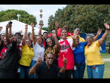 Credit: Contributed Development Bank of Jamaica employees celebrate their win in the mini-PAN competition at the Wellness Fair.