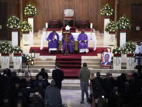 A Mass for former Zambian President Edgar Lungu is celebrated at the Cathedral of Christ the King, in Johannesburg, South Africa, Wednesday, June 25, 2025. (AP Photo/Themba Hadebe)