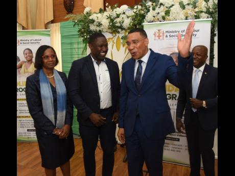 Credit: Ian Allen/Photographer Prime Minister Dr Andrew Holness (second right) shares a moment with (from left) Dione Jennings, permanent secretary in the Ministry of Labour and Social Security; Wavell Hinds, representative of the parliamenary Opposition; and Pearnel Charles Jr, ministe