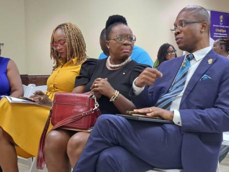Dr Kevin Brown (right), the president of the University of Technology Jamaica [UTech], speaks with Dr Venesse Morrison-Leon (centre), project lead and transformation officer in the Ministry of Education’s Transforming Education for National Development P