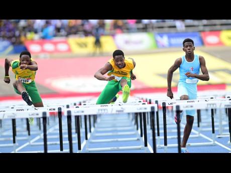 Marquies Page (left) of St Jago is now the number one under-18 sprint hurdler in the world.