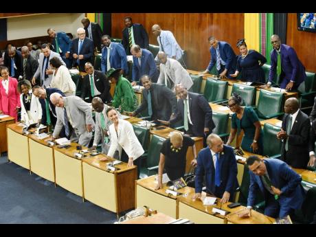 Government members applauds while the Throne speech was being read by Deputy Governor General Steadman Fuller during the Ceremonial Opening of Parliament on February 13.
