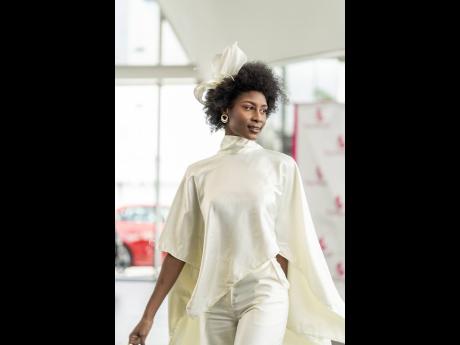 The 2016 Miss Jamaica World Ashli Barrett is elegance personified in the all-white set. 
