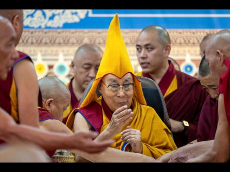 Tibetan spiritual leader the Dalai Lama presides over an event celebrating his 90th birthday according to a Tibetan calendar at the Tsuglakhang temple in Dharamshala, India, last Monday, ahead of his birthday, according to the Gregorian calendar, on July 6
