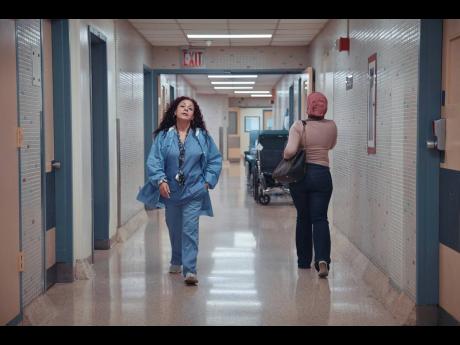Medical staff walk through a hallway at Brookdale University Hospital and Medical Center on Tuesday, July 1.