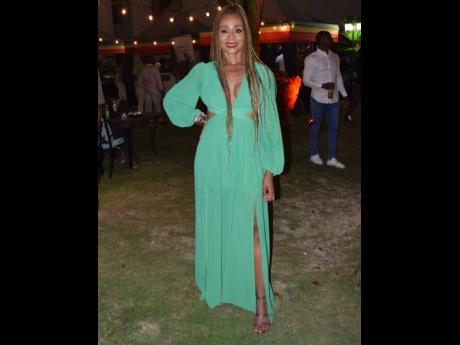 In this 2023 file photo, singer Nadine Sutherland, beautiful in green, could not miss the opportunity to celebrate with Best Reggae Album Grammy winner, Kabaka Pyramid. 