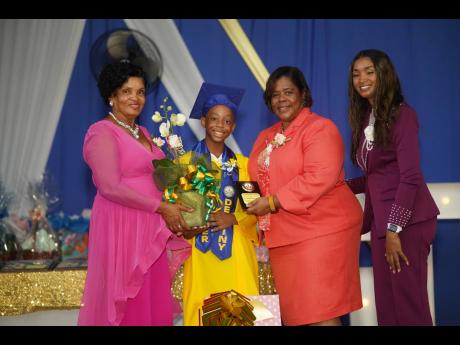 Credit: Dario Shields Photo From left: Yvonne Hill, principal of Greater Destiny Preparatory and Kindergarten School; Ifeanyi Hutchinson presenting Dr Walden-Pinnock, regional director of Region 4 in the Ministry of Education, Skills, Youth and Information with a token of appreciatio