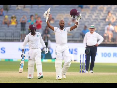 Kraigg Brathwaite raises his bat after scoring one of his 12 Test centuries.