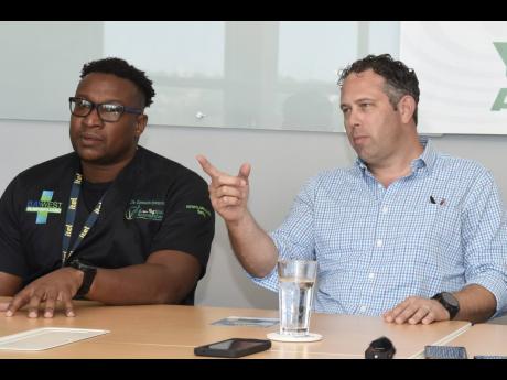 
Yoni Epstein (right), chairman, Montego Bay United Football Club (MBUFC), speaking while Dr Germaine Spencer, president of MBUFC, looks on during a press conference.