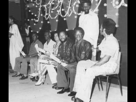 This 1974 photo shows Swing Award winners onstage at the National Arena. At the mic is Elaine Wint. The line-up of prizewinners (from left) Ranny Williams, Lawrence Rowe Sr, who accepted an award on behalf of his son, Lawrence Rowe Jr, Joyce Campbell, Rals