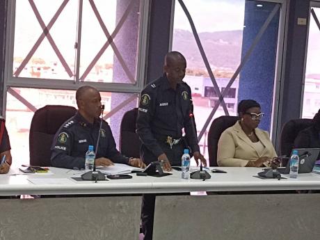 Credit: Photo by Christopher Thomas Inspector Orville Bushay (centre), the head of the Area One Police Division’s newly formed Agricultural Protection Branch (APB), addresses the St James Municipal Corporation’s monthly meeting on Thursday, July 10. Also pictured are Deputy Superintenden