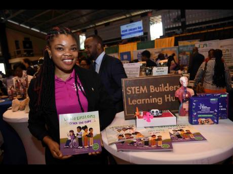 Kavelle Hylton, CEO and founder of STEM Builders learning Hub, explains the products and services of her business at the Ministry of Industry, Investment and Commerce’s MSME Linkages Day on Tuesday at the Alfred Sangster Auditorium at The University of T