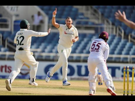Australia's Scott Boland celebrates after taking the wicket of West Indies' Jomel Warrican to complete a hat-trick on day three of the third Test match at Sabina Park in Kingston, Jamaica.