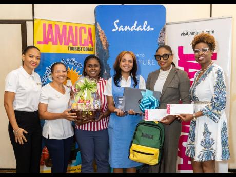 Credit: Contributed Caleader Lewison (fourth left), 2025 Junior Minister of Tourism, with (from left) Ilia Tomlinson, Group Digital Platforms Manager at Chukka Caribbean; Lyndsay Isaacs, Regional Public Relations Manager for Sandals Ochi Beach Resort; Dana Miller, Staff Advis