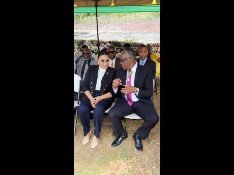 Credit: Contributed Custos of Manchester Garfield Green (right), in discussion with Chairperson of the Jamaica Cultural Development Commission (JCDC), Alecia Green.