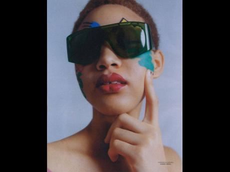 Chic specs are the order of the day for Sanique Dill in the new ‘Le Magazine du Monde’ editorial, ‘Voir Grand (Think Big)’, shot by Alexandre Guirkinger.