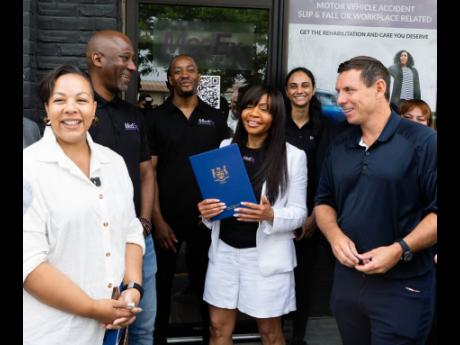 Cheryl Kerr, CEO & founder of MedEX Health Services (centre), is flanked by Charmaine Williams, MPP Brampton Centre (left) and Patrick Brown, City of Brampton’s Mayor (right). In the background are Hasani Brissett, Kerr’s son, Damion Duhaney and a staf