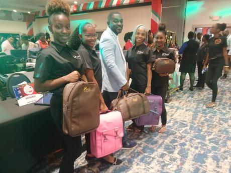 Above: And they are off with their Bresheh bags, (from left)  Latanya Francis; Ishema Persaud; Randy McLaren, co-founder and CEO of Bresheh Enterprises; Rasheen Oates and Sherissa Stewart.