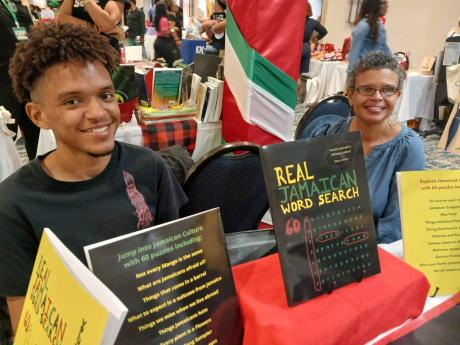 From left: Jonathan and Allison Morris had patrons doing the ‘Real Jamaican Word Search’.