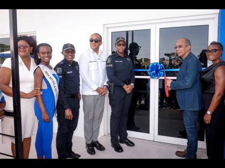 Credit: Photo by Ruddy Mathison From left: President of the Green Acres Citizens Association Dr Vanessa White-Barrow; Assistant Commissioner of Police Christopher Phillips; Dr Christopher Tufton, member of parliament for St Catherine West Central; Deputy Commissioner of Police Karina Pow