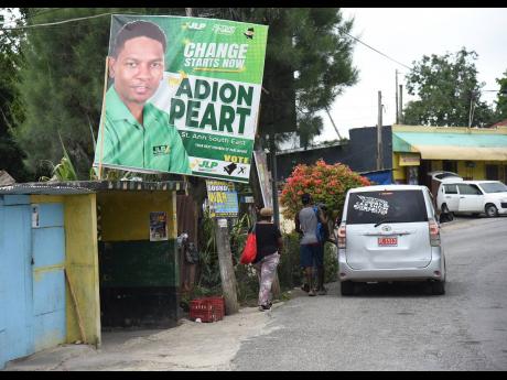 A poster for Adion Peart along the roadway in Golden Grove, St Ann.