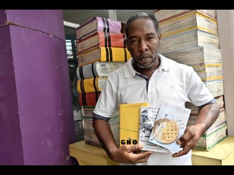 
Ricardo White visited the Kingston and St Andrew Parish Library to pick up two books for his 14-year-old son to read last Wednesday.