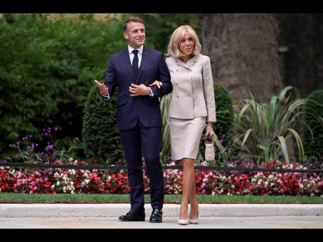 French President Emmanuel Macron and wife Brigitte arrive at 10 Downing Street in London, Wednesday, July 9, 2025.(AP Photo/Alberto Pezzali, Pool, File)