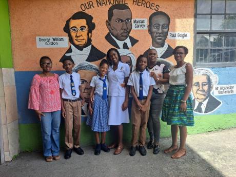 From left: Tamara Anderson-Reid and her son Tanner Reid, a grade six student of Hosanna Preparatory School in Montego Bay, St James; fellow student Tenese Mowatt, the school’s top girl in the Primary Exit Profile [PEP] exam, and her mother Nakino Linton-