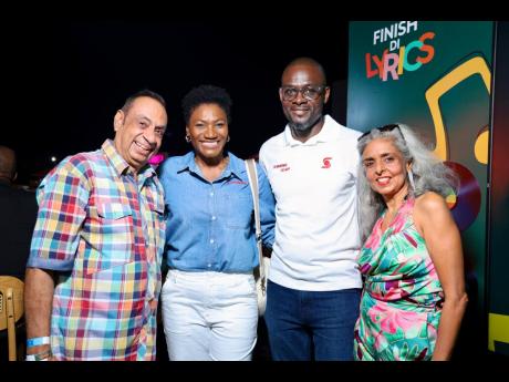 Lachu Ramchandani (left), managing director and CEO, Blue Diamond Shopping Mall, and wife Bina (right) join Audrey Tugwell Henry, president and CEO of Scotiabank, and Oral Heaven, centre director, Scotia Private Banking and Wealth Management, in the Scotia