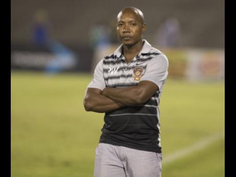Arnett Gardens head coach, Phillip Williams.