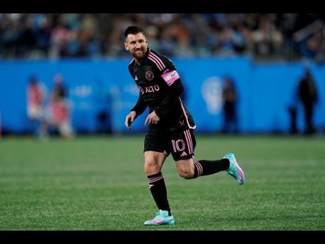 Inter Miami forward Lionel Messi reacts after missing a free kick during the second half of an MLS soccer match against Inter Miami, Saturday, October 21, 2023, in Charlotte, N.C. (AP Photo/Erik Verduzco)