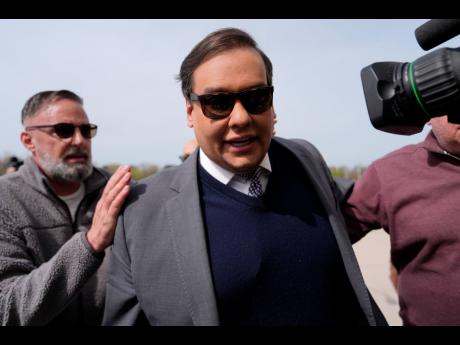 Credit: AP Julia Demaree Nikhinson Former US Representative George Santos arrives at federal court for sentencing, April 25, in Central Islip, New York.