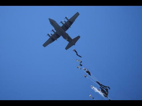 Humanitarian aid is airdropped to Palestinians over Zawaida, central Gaza Strip, last Thursday.