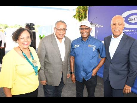 Credit: Contributed President of the Shipping Association of Jamaica, Corah Ann Robertson-Sylvester, shares a moment with (from second left) Opposition Spokesman on Industry, Investment and Global Logistics, Anthony Hylton; Minister of Industry, Investment and Commerce, Senat