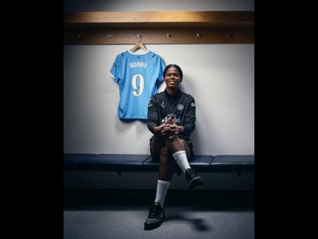 Manchester City’s Khadija ‘Bunny’ Shaw with her new number-nine jersey to start the 2025-26 Women’s Super League City