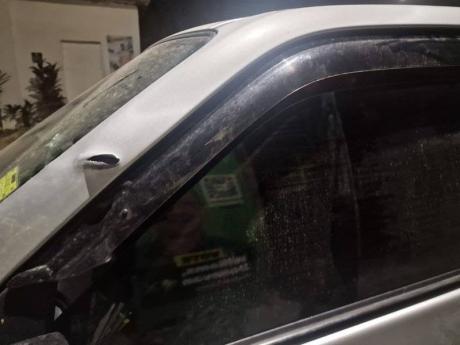 One of the vehicles damaged during Tuesday's shooting in Kingston Central.