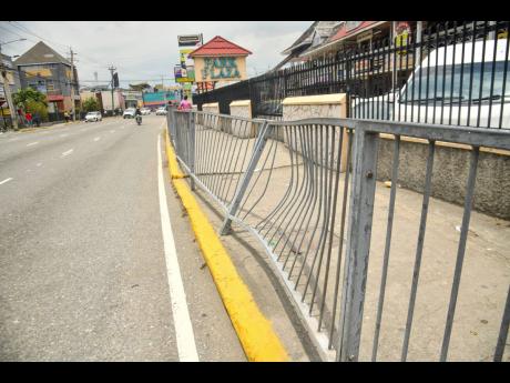 Battered railings at a section of Constant Spring Road.