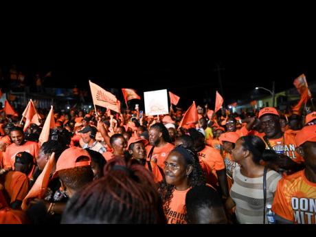 Supporters of the People’s National Party during a parish meeting in Christiana, Manchester last month. 