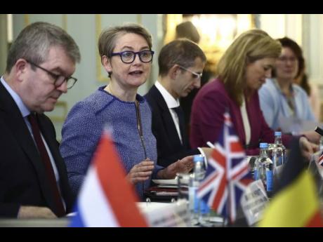Britain's Home Secretary Yvette Cooper, 2nd left, chairs a meeting of European ministers and agencies at Carlton Gardens in London, Tuesday, December 10, 2024.