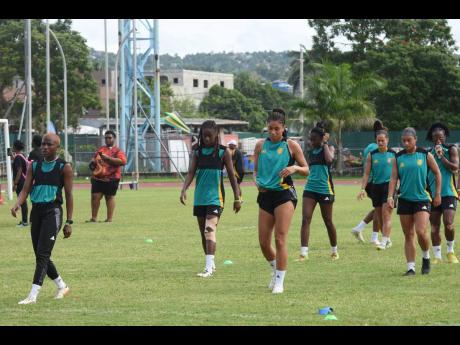 Members of Jamaica’s Reggae Girlz warm up ahead of a training session at the Montego Bay Sports Complex on Thursday, November 28, 2024.