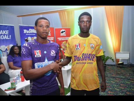 Kingston College’s Raje Ximines (left) and  Omarian O’Brian of Garvey Maceo High in football gear for the new schoolboy football season at the official launch of the Inter-Secondary Schools Sports Association competitions  on August 20, 2025 at the Sum