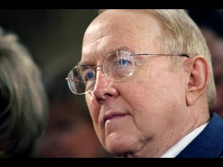 In a Tuesday, March 11, 2008 photo, Christian evangelical leader and founder of “Focus on the Family”, James Dobson, listens to President Bush, not pictured, address the National Religious Broadcasters 2008 Convention at the Gaylord Opryland Resort and