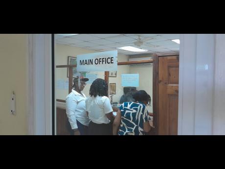 
Parents turn up at Quality Academics for supporting documents to have their children transferred to other schools, after the private institution was forced to close after an expired lease.