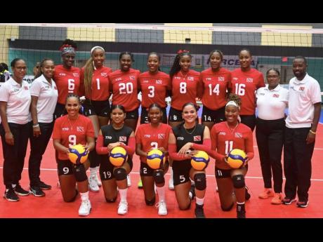 Trinidad & Tobago pose for a team photo after winning the women’s title at the Caribbean Volleyball Championships in the Bahamas. 